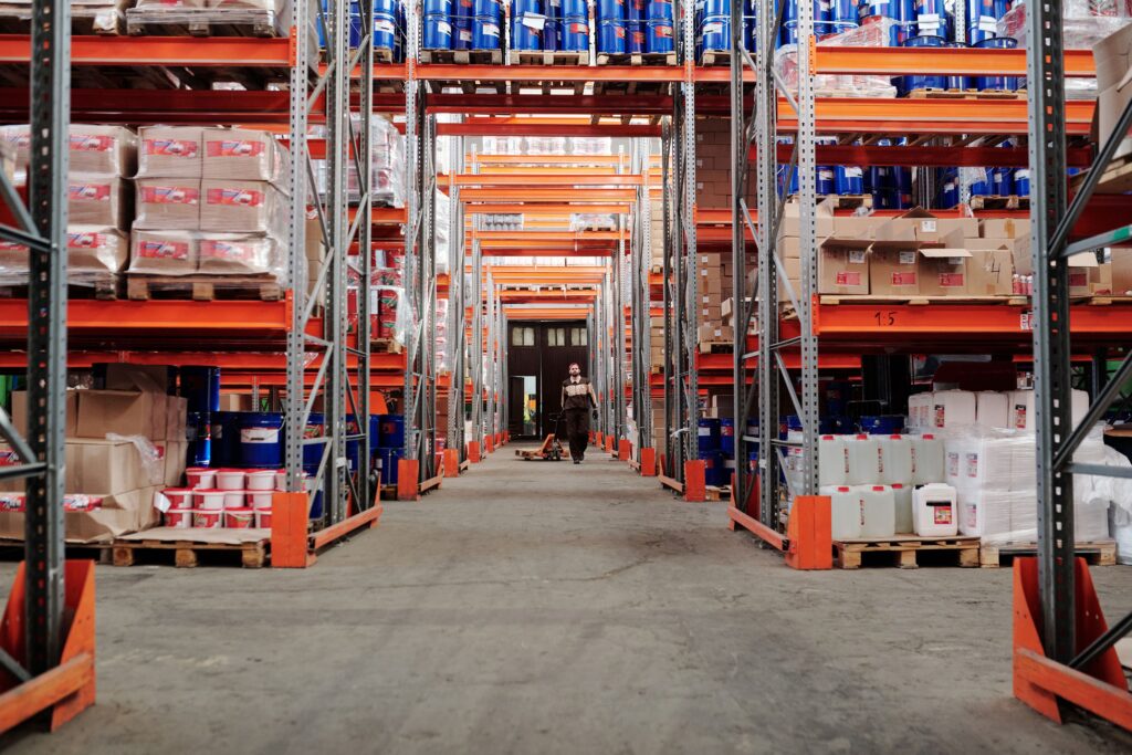 Warehouse racking aisle representing growing cold storage and logistics capacity in Singapore